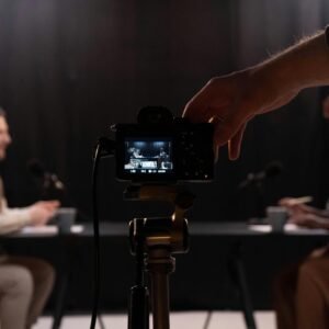 Professional podcast session recording with diverse hosts in studio.